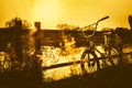 Bike parking silhouette with sunset near the river vintage Royalty Free Stock Photo