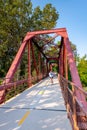 Bike path bridge with a cycler passing over Royalty Free Stock Photo