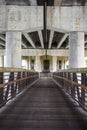 Pedestrian bridge under highway in urban area Royalty Free Stock Photo