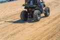 bike pattern at beach, bottom view of modern red all-terrain vehicle standing in beach on cloudy day,Motor cross sports on ocean Royalty Free Stock Photo