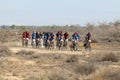 Bike race on desert road Royalty Free Stock Photo