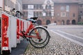 Bike rack for rental bicycles. Bicycle hire parking, bikes for rent in Pavia city. Bicycle rental service station