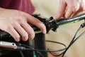 Bike repair. Bicycle fixing. Hex wrench works. Man configures th Royalty Free Stock Photo