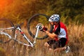 Bike repair. Young man repairing mountain bike Royalty Free Stock Photo