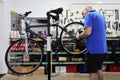 Bike repairer fixing a bicycle in a workshop