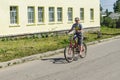 Bike ride in a Russian village in the Kaluga region. Royalty Free Stock Photo