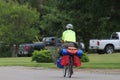 A Bike Rider riding cross country with camping gear that`s staying in a camp ground in Kansas.