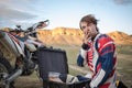 Bike rider relax mountains near motorcycle, antenna smoke Royalty Free Stock Photo