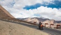 A bike rider riding on the curvy roads of himalayas to Leh, Ladakh
