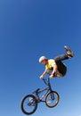 Bike rider tricking while jumping during bikes competition vertical