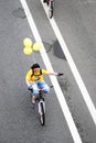 A bike rider in yellow t-shirt