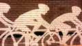 Bike riders mural on brick wall Royalty Free Stock Photo