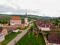 Bike route in Cloasterf Saxon Village and Fortified Church in Transylvania, Romania. Cyclist on the road. Bike ride recreation in Royalty Free Stock Photo