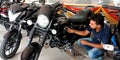 bike seller showing latest model avenger motorcycles at bajaj bike showroom in india