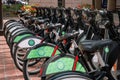 Bike share bikes lined up in a bike rentals station. In many ciries around the world bike sharing became poular and healthier Royalty Free Stock Photo