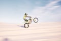Bike, speed and balance with a sports man riding a vehicle in the desert for adventure or adrenaline. Motorcycle