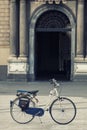 Bike in a square in front historic building. Nobody Royalty Free Stock Photo