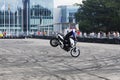 Bike stoppie motorcycle stunt rider acrobatics Royalty Free Stock Photo