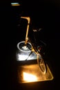 Bike stride illuminated by a lantern at night