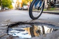 bike tire near a pothole, risk of accident and damage