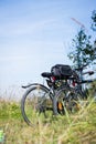 Bike tour: Bikes, grass and blue sky. Outdoors, text space Royalty Free Stock Photo