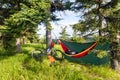 Bike travel and camping with hammock in summer woods