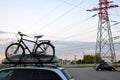 Bike and trunk fixed on the roof of the car