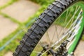 Bike waiting mechanic for repair in bicycle repair shop, outdoor. Bicycle wheel close up ready for examines, fixes Royalty Free Stock Photo