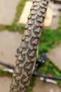 Bike waiting mechanic for repair in bicycle repair shop, outdoor. Bicycle wheel close up ready for examines, fixes Royalty Free Stock Photo