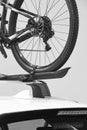 Bike wheel detail on a car roof. Transportation system Royalty Free Stock Photo