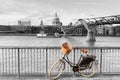 Bike with wicker basket against St Pauls backdrop,