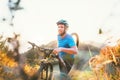 Cyclo-cross competition member Man mountain biker carrying his bike up on hill top Royalty Free Stock Photo