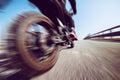 Biker in action riding on the road spring and summer outdoors leisure season and freedom conceptt- toned with a trendy filter Royalty Free Stock Photo