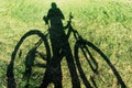 Biker and bicycle shadow Royalty Free Stock Photo