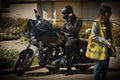 Biker on a black Harley Davidson cruiser motorcycle in the street