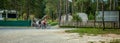 Biker couple biking around a glamping resort at Bloke Lake at Nova Vas, Slovenia