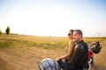 Biker couple on the country road against the sky Royalty Free Stock Photo