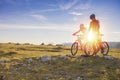 Biker couple with mountain bike pointing in distance at countryside Royalty Free Stock Photo