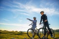 Biker couple with mountain bike pointing in distance at countryside Royalty Free Stock Photo