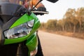 Biker driving his motorcycle on the forest road. unisex, woman or man concept.