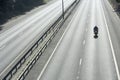 Biker On An Empty Highway