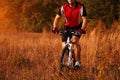 Biker on the forest road riding outdoor