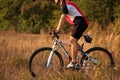 Biker on the forest road riding outdoor