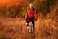 Biker on the forest road riding outdoor