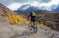 Biker-girl in Himalaya mountains, Anapurna region Royalty Free Stock Photo