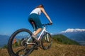 Biker-girl in Himalaya mountains Royalty Free Stock Photo