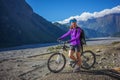 Biker-girl in Himalaya mountains, Anapurna region Royalty Free Stock Photo