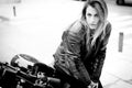 biker girl in a leather jacket on a motorcycle Royalty Free Stock Photo