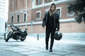 Biker girl in a leather jacket on a motorcycle Royalty Free Stock Photo