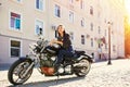 Biker girl in a leather jacket on a motorcycle Royalty Free Stock Photo